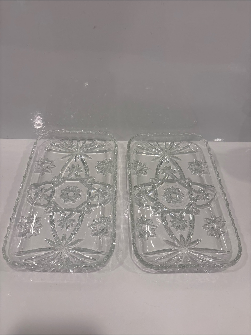 Vintage pair of pressed glass serving trays starburst pattern clear